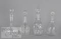 Four colorless glass decanters