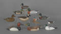 Group of eleven miniature contemporary carved and painted duck decoys