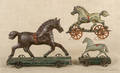 Three early American painted tin horse pull toys