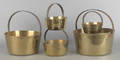 Five brass pots with fixed iron handles