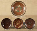 Collection of four redware plates