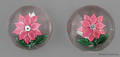 Two antique poinsettia paperweights