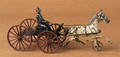Harris cast iron buckboard wagon with a slat bed