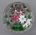 John Deacons floral paperweight with a star cut base
