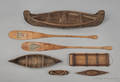 Four miniature bark canoes