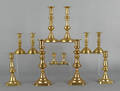 Six pair of brass candlesticks