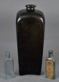 Olive glass gin bottle