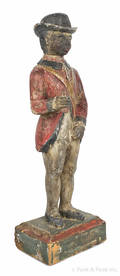 Carved and painted pine figure of a black soldier 19th c