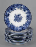 Fourteen flow blue plates and shallow bowls