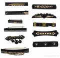 Eleven Victorian black onyx bar pins with gold and seed pearls