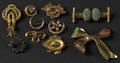Ten 14K yellow gold brooches and pins