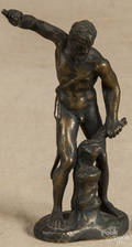 Bronze figure of a nude gentleman iron worker