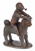 Pennsylvania redware figure of a monkey with a pipe riding a dog 19th c