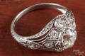 Platinum diamond dinner ring with a center Old European cut diamond
