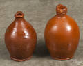 Two Pennsylvania redware jugs