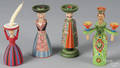 Four Swedish handpainted wooden doll candle holders