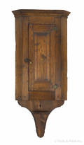 Pennsylvania walnut hanging corner cupboard early 19th c