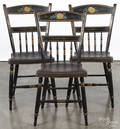 Three Pennsylvania painted half spindle plank bottom chairs
