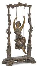 Bronze figure of a girl in a swing