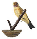 Carved and painted hanging songbird