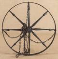 Wood and iron wagon wheel form chandelier
