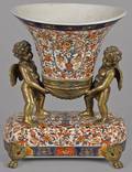 English Imari palette centerpiece with bronze putti mounts
