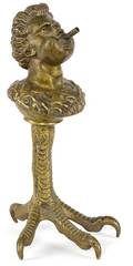 Bronze figural mythological bust countertop cigar lighter with a bird talon base