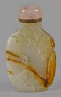 Chinese carved celadon and russet jade snuff bottle