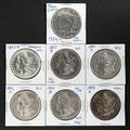 Six silver Morgan dollars