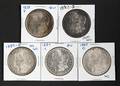 Five silver Morgan dollar coins