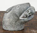 Inuit soapstone carving of a sea lion with a mans head