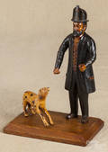 Contemporary carved and painted fireman and his dog