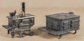Two cast iron toy stoves
