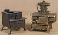 Two cast iron toy stoves