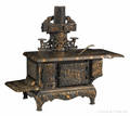 Kenton cast iron and tin  Globe Range  toy stove with a copper flashed surface