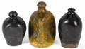 Three redware bottles 19th c