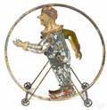 German painted tin clockwork clown acrobat in a hoop