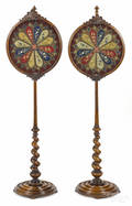 Pair of Continental carved walnut pole screens mid 19th c