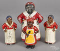 Four cast iron mammy still banks