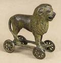 Cast iron Lion on Wheels penny bank