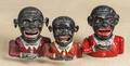 Three aluminum Jolly Black Man mechanical banks