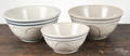 Three blue and white stoneware mixing bowls