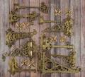 Ten brass wall mounted hangers