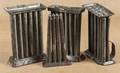 Four tin candle molds