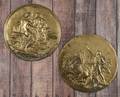 Two cast brass wall plaques