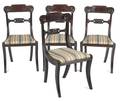 Set of four classical mahogany saber leg dining chairs