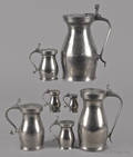 Seven graduated English double volute pewter measures late 18th c