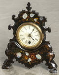 Cast iron front shelf clock with motherofpearl inlay