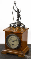 Junghans rotary mystery shelf clock with barber pole inlay and a figural putti