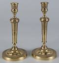 Pair of French style brass candlesticks with detailed beaded and overlapping scale accents